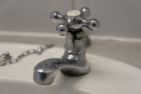 Cracked tap. Cold water forcet with split in the metal.