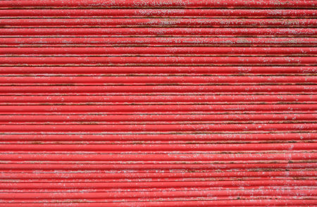 Red old corrugated iron sheet for grunge background or texture.の写真素材