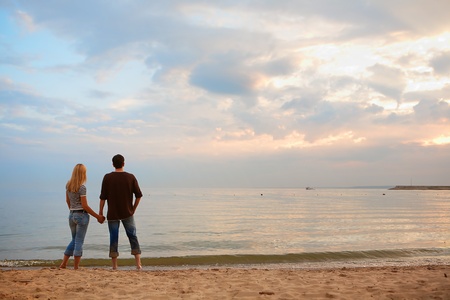 couple in love on the beach. summer evening, the sunsetの写真素材