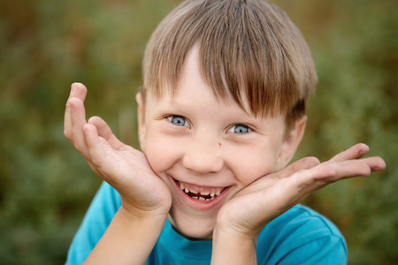 gray-eyed boy Gray-eyed boy looking at the camera and laughingの写真素材