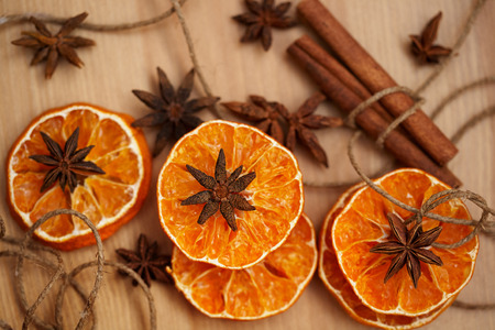 Spices and dried slices of tangerines for the manufacture of Christmas decorationの写真素材