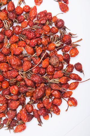 sprinkle of rose hips on a white backgroundの写真素材