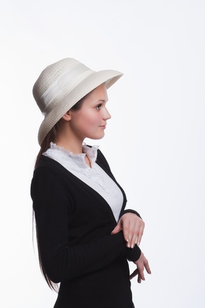 girl in the hat is smiling to someoneの写真素材