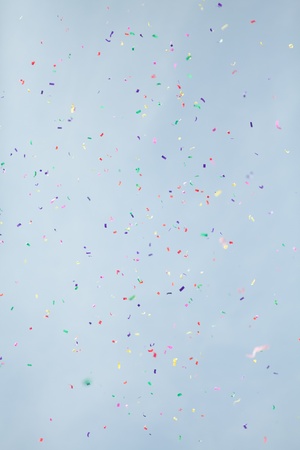 confetti on blue sky backgroundの写真素材