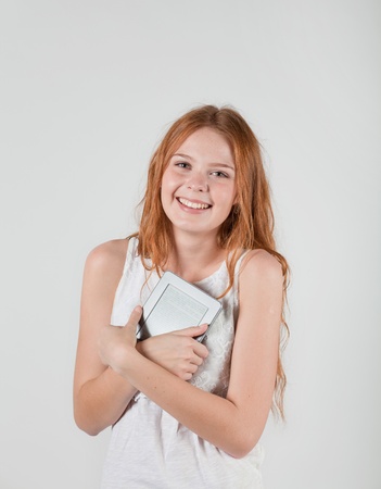 girl keeps the e-book in handの写真素材