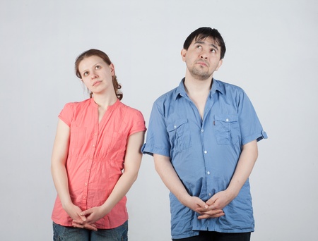 Two young stand there and look upの写真素材