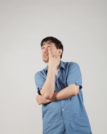 emotional young man smtoit up thinkingの写真素材