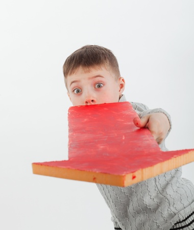 boy with an arrow indicating to usの写真素材