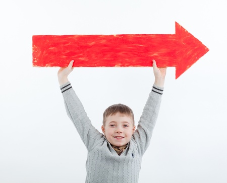 boy with an arrow points toward theの写真素材