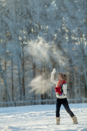 Young woman in a snowy furry hoodの写真素材