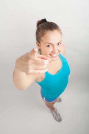 beautiful sports girl stretches out her hand towards the cameraの写真素材