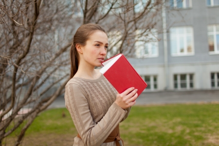 Young girl reading a bookの写真素材