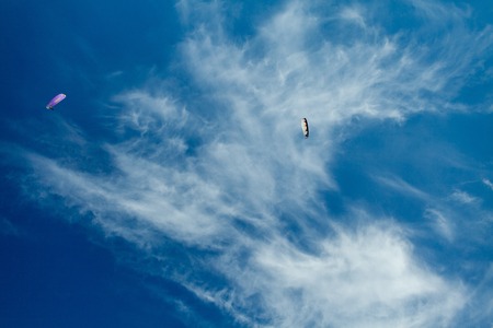 paragliders in the blue skyの写真素材