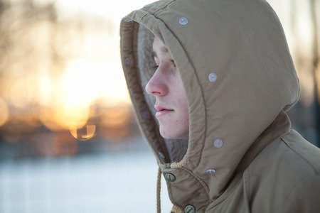 young man in winterの写真素材