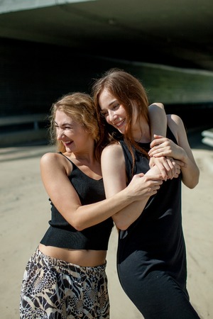 girlfriend in the arms go and laugh