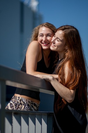 girlfriend in the arms go and laugh