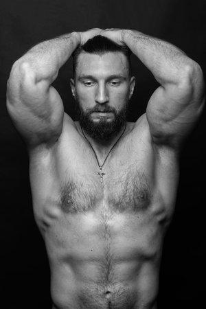 Portrait of a handsome man with a beard on a black backgroundの写真素材