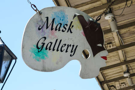 New Orleans - 04/15/2018: Mask gallery shop insignia in the French Quarterのeditorial素材