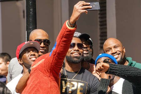 New Orleans - 04/15/2018: group selfie with a rapper in Bourbon Streetのeditorial素材
