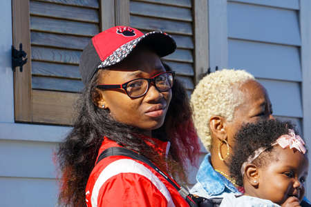 New Orleans - 04/15/2018: a very young mother with babyのeditorial素材