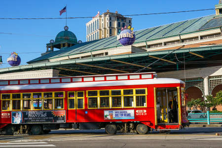 New Orleans - 04/15/2018: a red old tram stop in front of Harrah Casino in Canal Streetのeditorial素材