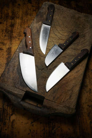 Mortara 09/10/2019: different size kitchen knives on wooden cutting boardの写真素材