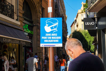 Saintes Maries de la Mer - 09/04/2020: tourists in a street and in the background Baroncelli museum buildingのeditorial素材