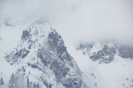 Madonna di Campiglio, Trentino Alto Adige, Italy - 01/28/06: Dolomites mountains in winter under snow stormの写真素材