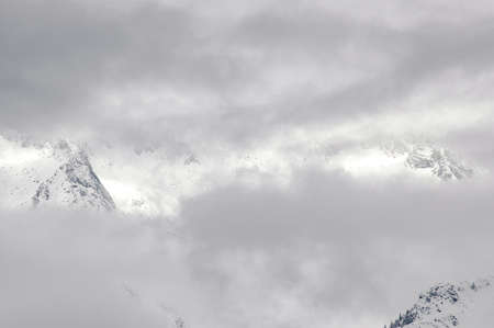 Madonna di Campiglio, Trentino Alto Adige, Italy - 01/28/06: the Dolomites snow-capped mountains and a snowy skyの写真素材