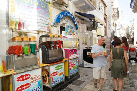 Peschici - 29/06/2021: famous italian ice cream shop with people in Peschici at night, Puglia, Italyのeditorial素材