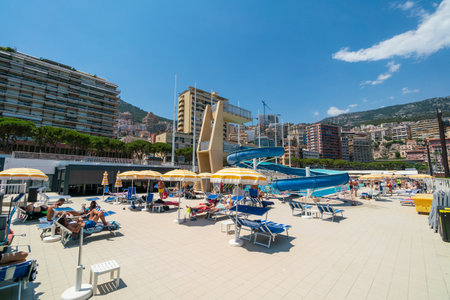 People sunbathing on the beach in Monte Carlo, Monacoのeditorial素材