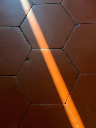 terracotta floor tiles antique with ray of lightの写真素材