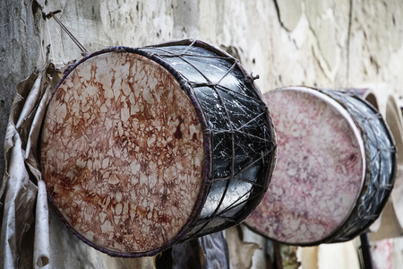 Essaouria, Morocco - September 2017: african drums (tbel) hung on the outside the workshop where it was handmadeのeditorial素材