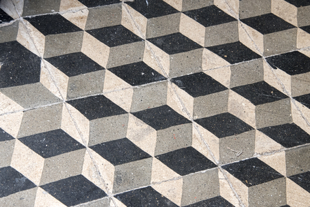 Essaouria, Morocco - September 2017: black, white and Grey floor tiles laid out in a geometric patternのeditorial素材