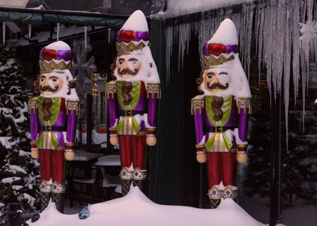 Tri of soldier  Christmas decorations in  snow and ice