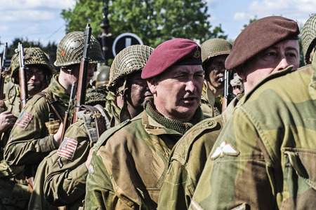 LEICESTERSHIRE,UK  - JUNE 07 2015: Men dressed in wartime US army soliders uniform reenacting...