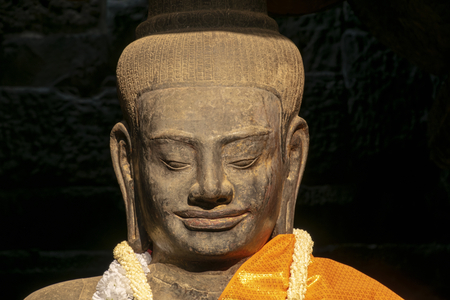 Angkor Wat, Cambodia - March 2016: Ancient Buddha statue,  still used by the local population as a place of worship within the Angkor Wat complexのeditorial素材