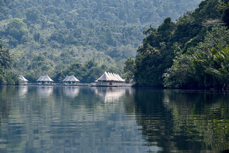 Cambodia, Ko-Hong - March 2016: 4 rivers tented jungle ecotourism hotel coming into view around a bend in the Kong Riverのeditorial素材