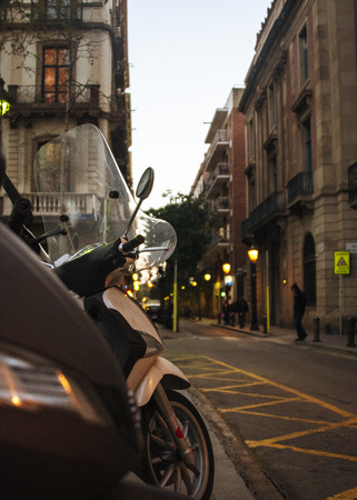 SPAIN,  BARCELONA aPRIL 2018 - Mopeds at the side of the road, early eveningのeditorial素材