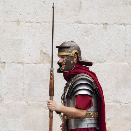 Croatia, Split - June 2018: Re-enactors dressed as Roman Legionnaires, wait to pose with Tourists at the gates to the  Diocletian Palaceのeditorial素材