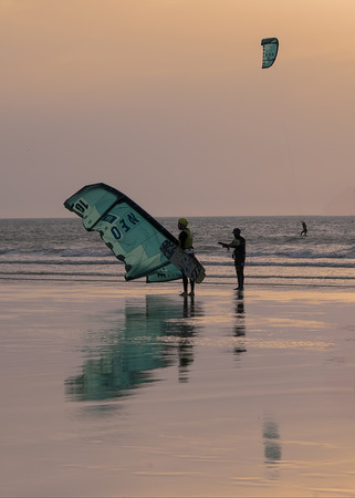 Essaouria, Morocco - September 2017: 
Kite surfers returning from the sea as the sun setsのeditorial素材