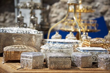 Bosnia and Herzegovina, Mostar - June 2018:  Polished metal trinket boxes on sale in a local tourist bazaar の写真素材