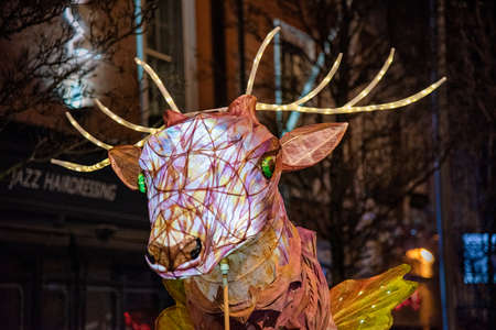 Nottigham, UK - Feb 2020: Paper lantern, shaped like a Deer's head lighting the parade during the annual festial of lights.のeditorial素材