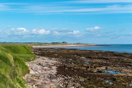 UK, Bamburgh - June 2019: Bamburgh Castle viewed from the coastのeditorial素材