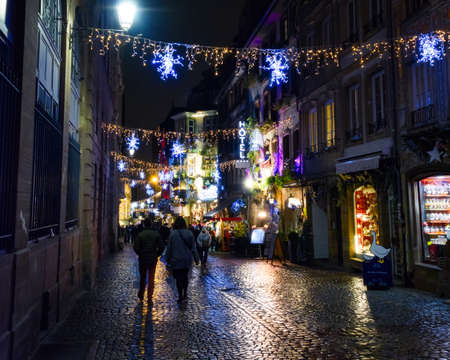 FRANCE, STRASBOURG - 20 DECEMBER 2017: People visiting the Christmas market. The Christmas market is held across the centre Strasbourg every year.のeditorial素材
