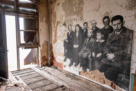 USA, New York, Ellis Island - May 2019: Dilapidated room wiht Art installation by JR ,Immigrants awiting processingのeditorial素材