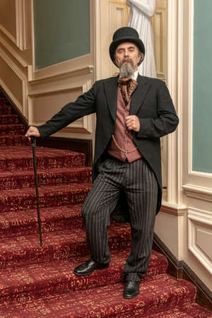 UK, Market Bosworth, Victorian Christmas Fair - December 2015: re-enactor dresses as a victorian gentlemen  - Charles Dickensのeditorial素材