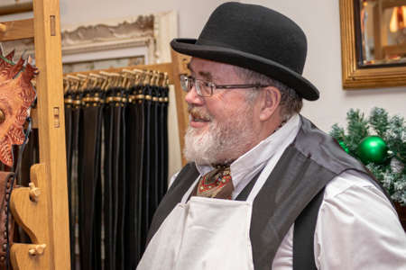 UK, Market Bosworth, Victorian Christmas Fair - December 2015: re-enactor dresses as a victorian shopkeeperのeditorial素材