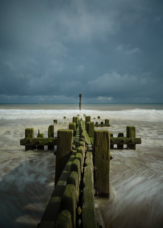 Maundsley Beach Groyne and incoming tideの写真素材
