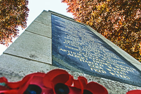 War Memorial Names with Red Poppies at Baseの写真素材